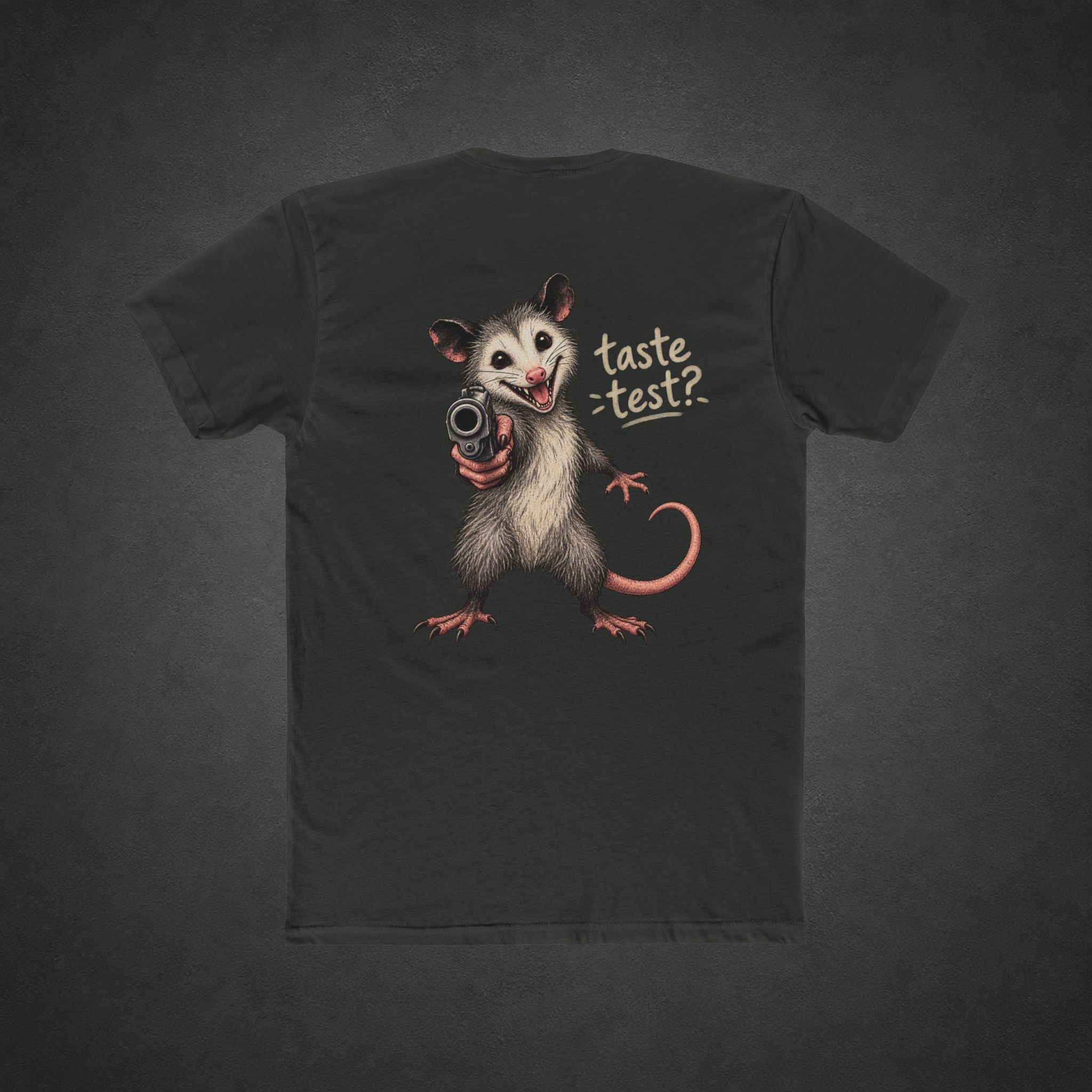 Taste Test Tee — t-shirt printed with a grinning cartoon opossum pointing a pistol next to the words “Taste Test?”